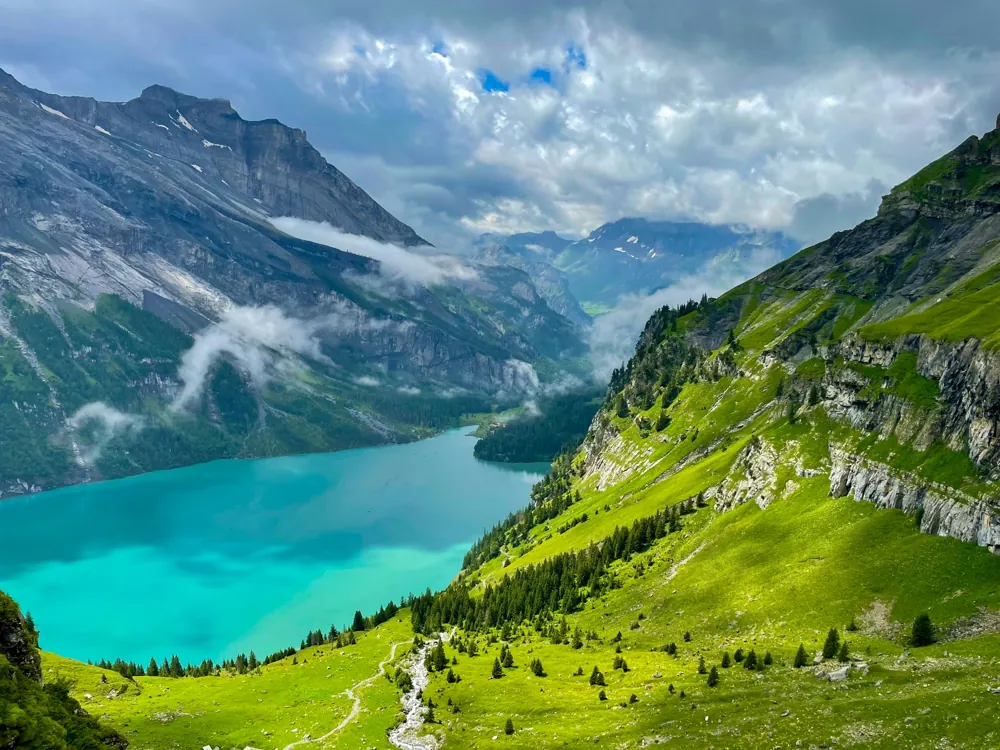 Alpine peaks rising above a clear mountain lake