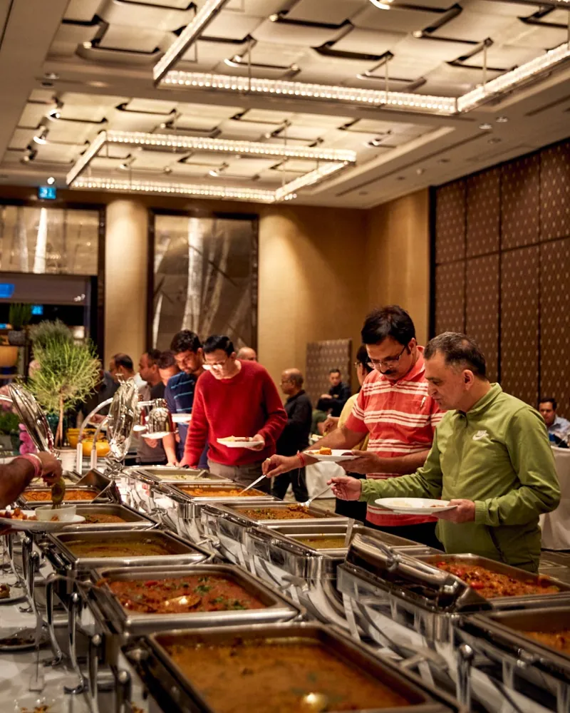 Guests enjoying a catered buffet with a selection of dishes