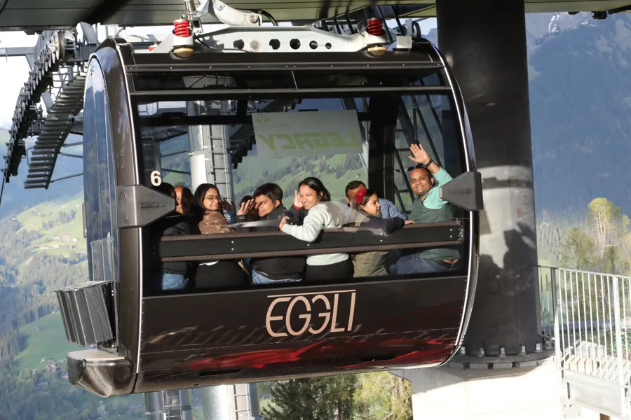 Guests smiling inside an Eggli gondola