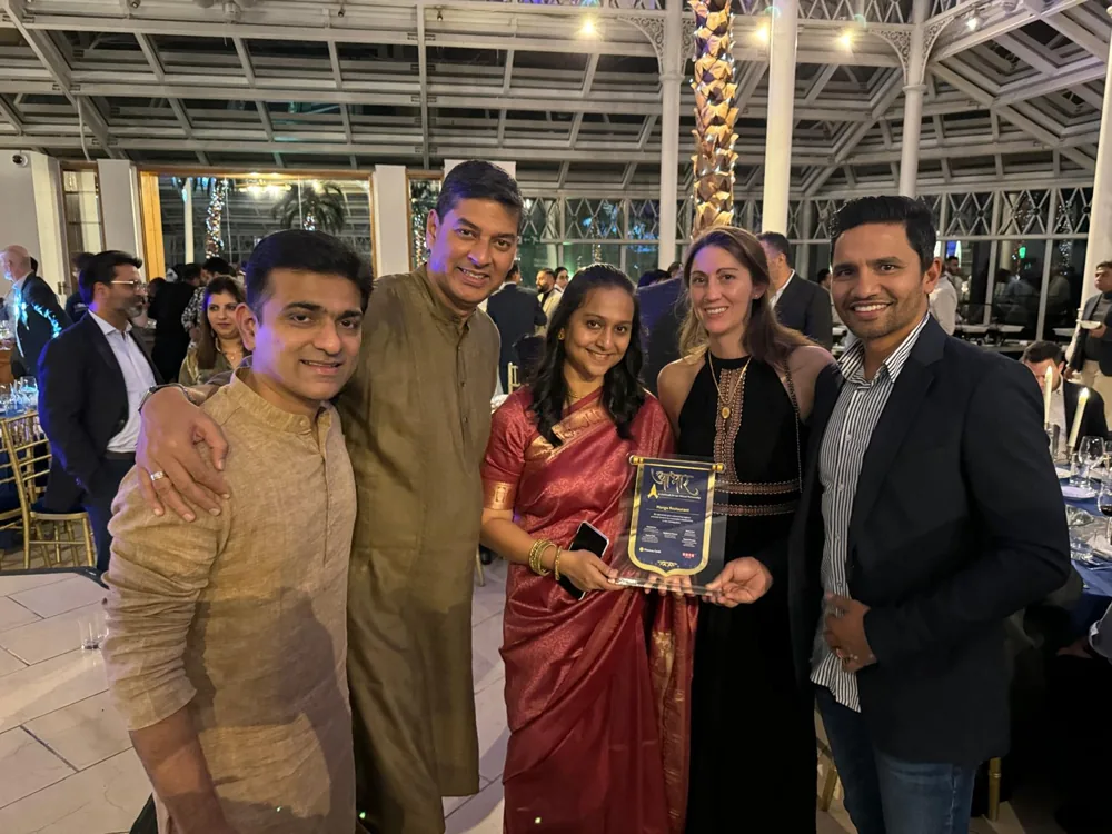 Sathya and Linda Narayanan, on the right of the group, at the Thomas Cook India awards night